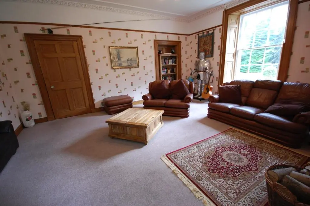 a living room with couches and a coffee table at The Old Manse, Fochabers in Fochabers