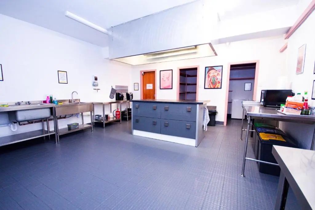 a large kitchen with counters and sinks in a room at Weston House Keith in Keith