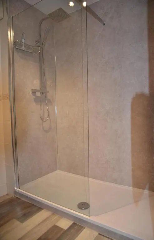 a shower with a glass door in a bathroom at SCOTTISH HIGHLANDS Superb 2 bedroom apartment. in Invergarry