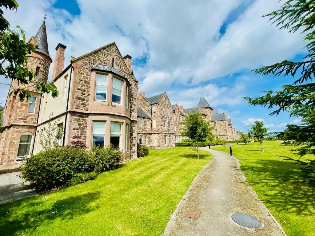 an old mansion with a grassy yard at Great Glen Townhouse Inverness - Entire 3 Story Townhouse in Inverness