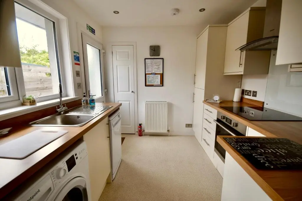 a kitchen with a sink and a counter top at 'Edgewood' - spacious detached bungalow in Inverness