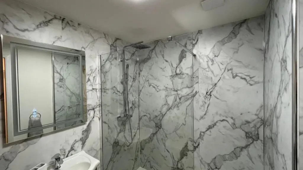 a bathroom with a sink and a mirror at The Forge by Caithness Luxury Apartments NC500 - Elegant Luxury Apartment with Bike store - Sleeps 4 in Wick