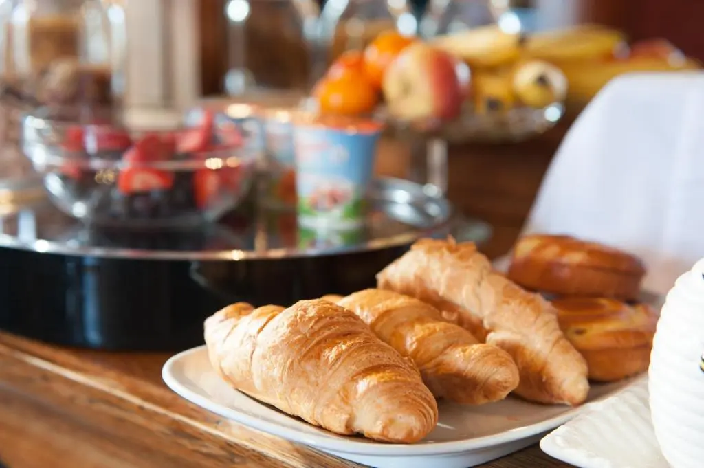 a plate of croissants and pastries on a table at Strathallan Bed and Breakfast in Grantown on Spey