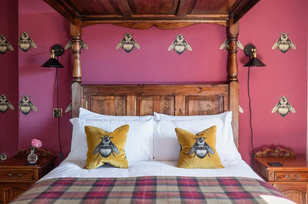 a bedroom with a bed with skulls on the wall at Strathallan Bed and Breakfast in Grantown on Spey
