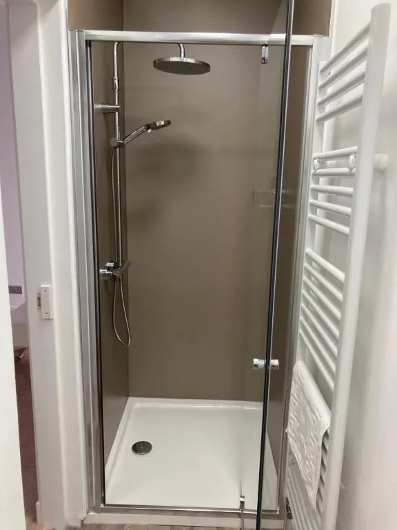 a shower with a glass door in a bathroom at Haugh Ness in Inverness
