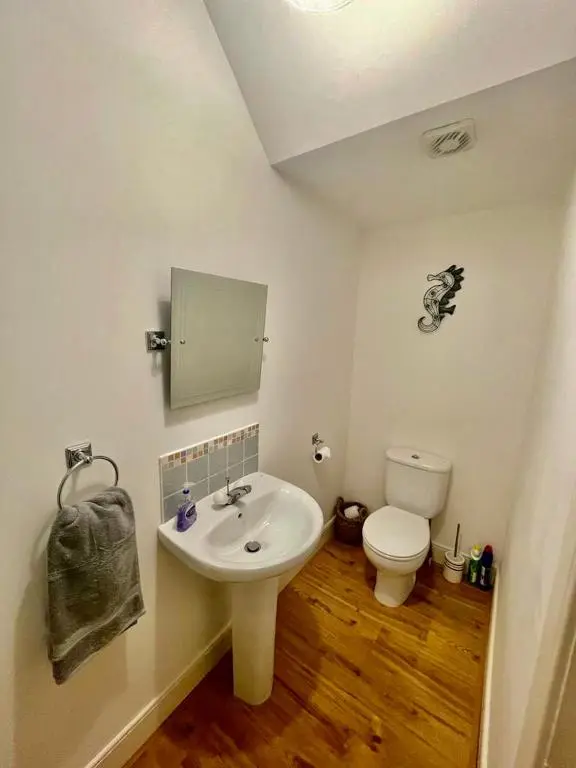 a bathroom with a sink and a toilet at Serviced Accommodation Moray - Lesmurdie House No 2 in Elgin