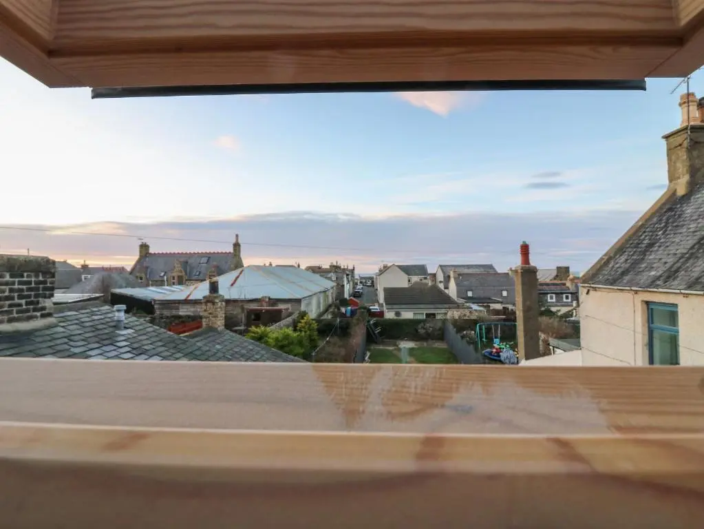 a view of the city from a window at RockStar Cottage in Macduff