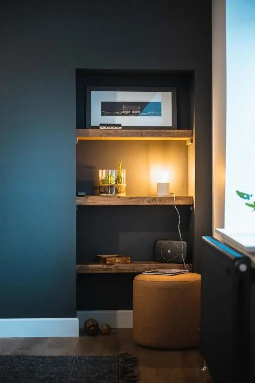 a room with a shelf with a television on it at Drumdry in Wick