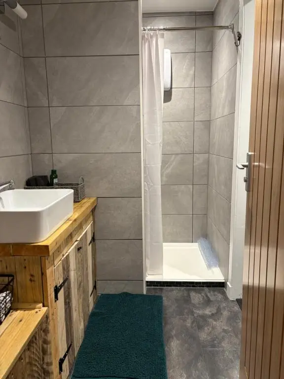 a bathroom with a sink and a shower at Ardenbeg in Grantown on Spey