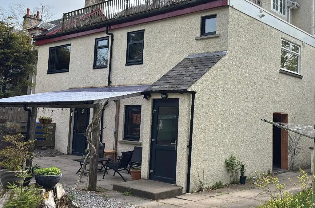 a house with an awning on the front of it at Ardenbeg in Grantown on Spey