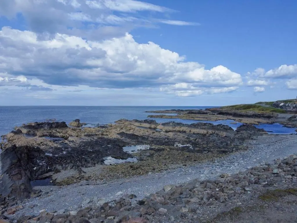 a rocky shore with the ocean in the background at Moray View, Macduff, Aberdeenshire. in Macduff