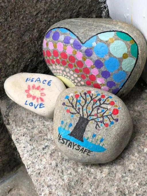 three rocks with a tree painted on them at Spacious 2 Bedroom Flat in heart of Ballater in Ballater