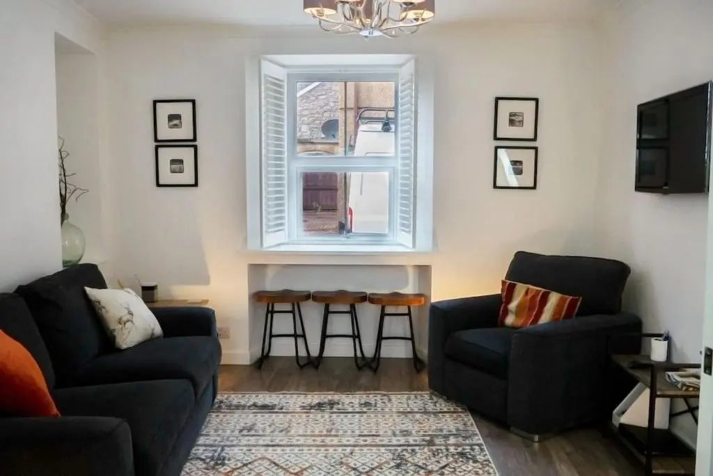 a living room with two couches and a window at Central 2 bedroom luxury home close to River Ness in Inverness