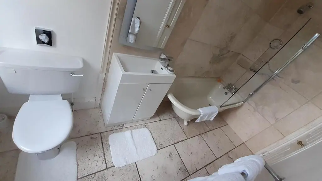 an overhead view of a bathroom with a toilet and a shower at Trafford Bank Guest House in South Kessock
