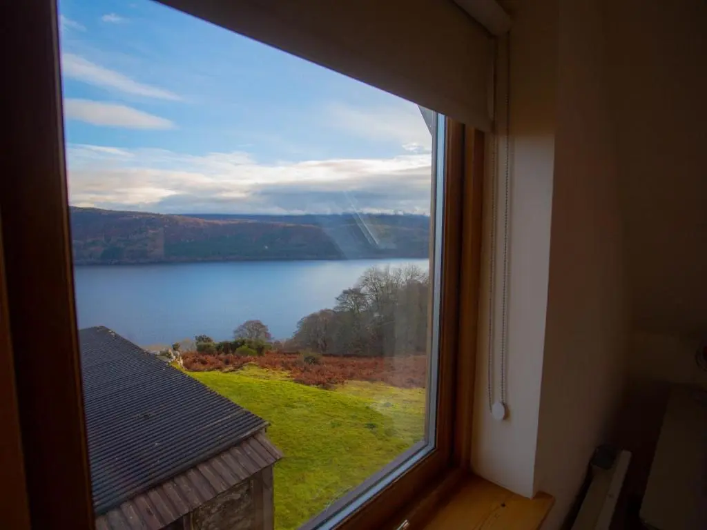 a view of a lake from a window at Holiday Home Peter's Shed by Interhome in Drumnadrochit