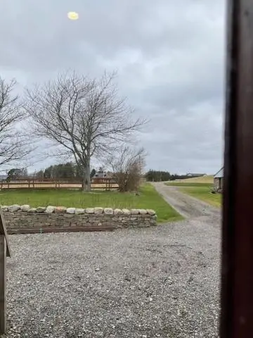 a stone bench on the side of a road at Ben View Aberlour Luxury Barn Conversion in Aberlour