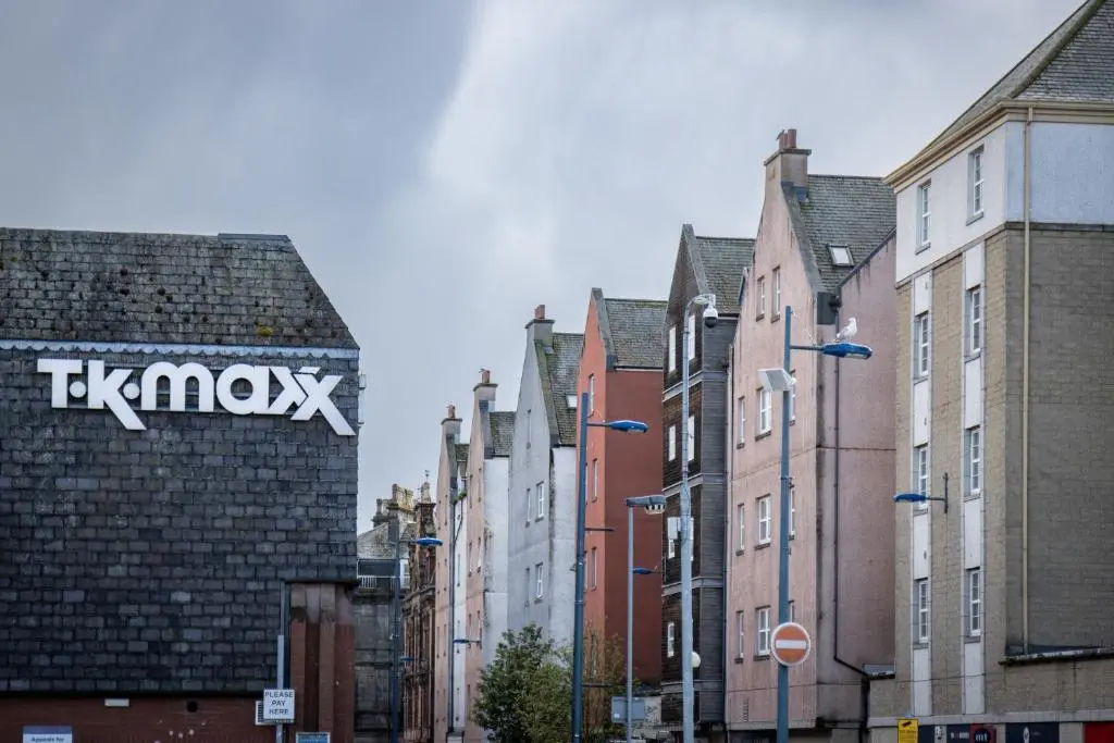 a group of buildings in a city with a street at The Rooftops Reservation in Inverness