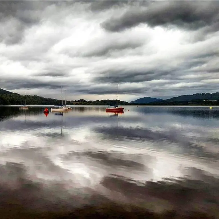 a large body of water with boats in it at The Byre - by Where Stags Roar in Newtonmore
