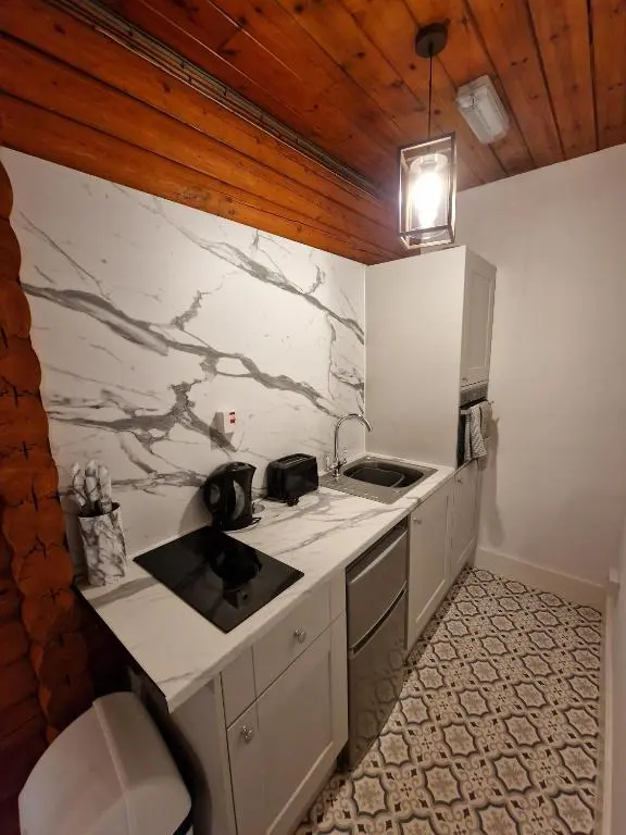 a kitchen with a sink and a counter top at Kaoglen Warren - Pet friendly - Hot Tub - Cairngorms in Blairgowrie