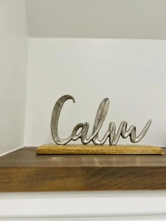 a metal sign that reads ally at St Duthus Villa Guesthouse in Tain