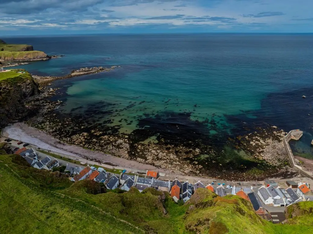 an aerial view of a beach and the ocean at Fisherman's Cottage in Pennan in Pennan
