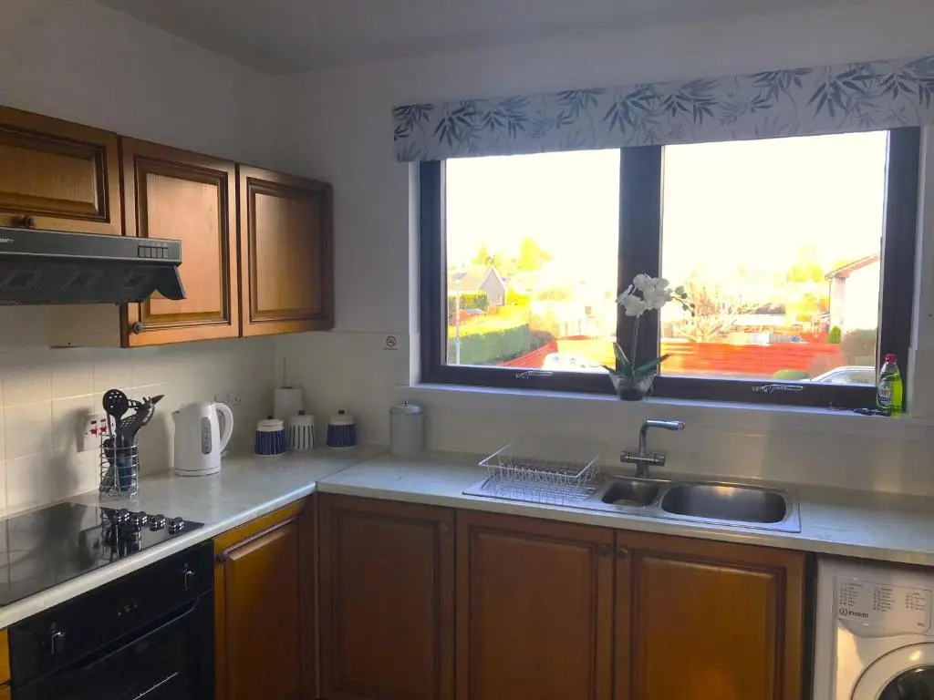a kitchen with a sink and a large window at No. 9 in Inverness