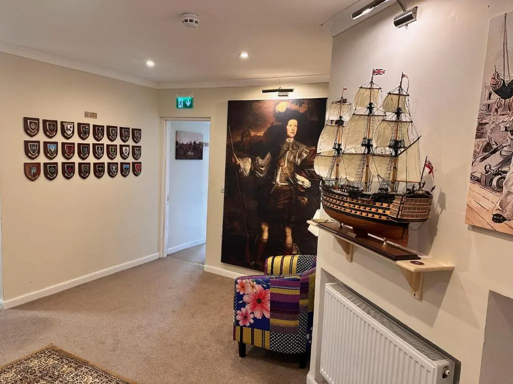 a room with a pirate ship on the wall at Forces Manor in Kincraig