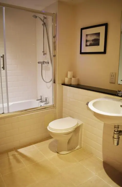 a bathroom with a toilet and a sink at Cannon Point BW7 in Fort Augustus