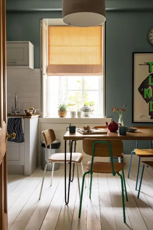 a kitchen with a table and chairs and a window at North Lodge & River Cabin in Banchory