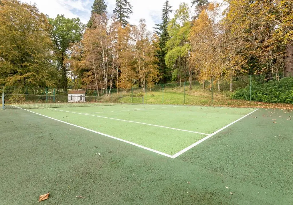 a tennis court in a park with at The Kennels in Ballogie