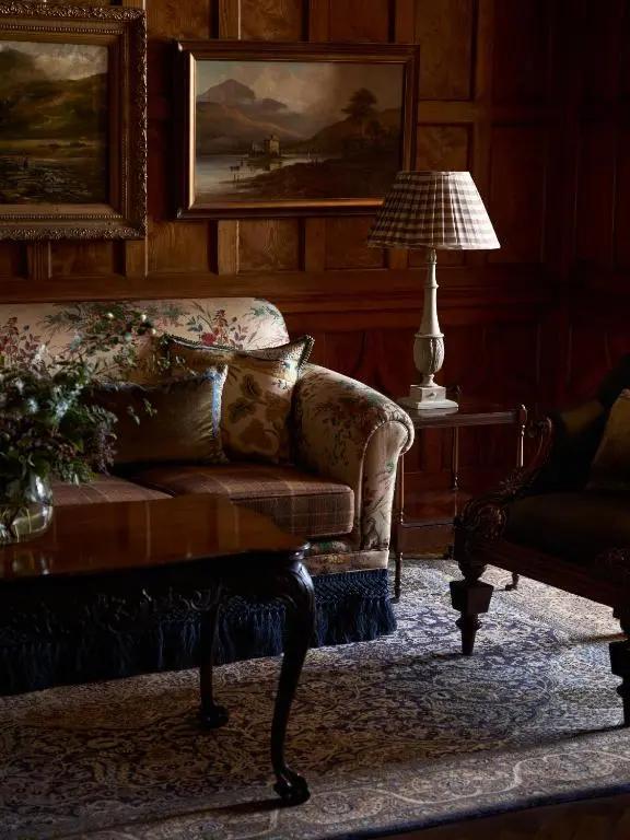 a living room with a couch and a table at Dornoch Station in Dornoch