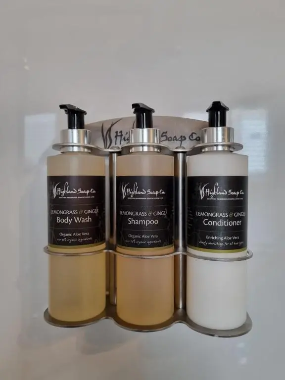 a group of three perfume bottles sitting next to each other at Craggan in Ballater