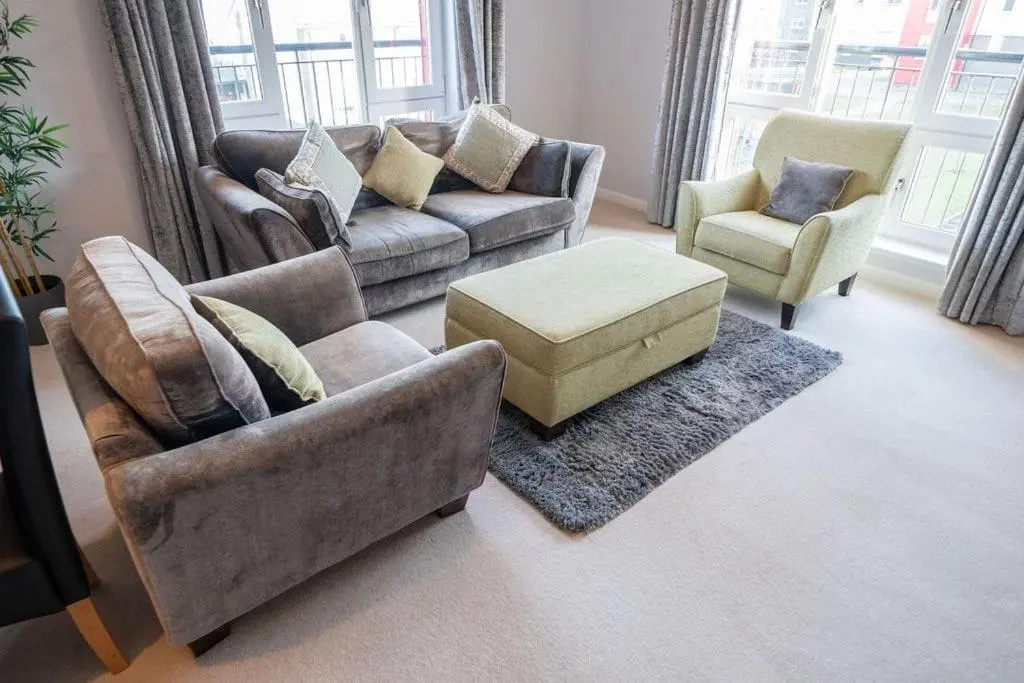 a living room with two couches and two chairs at Hope House - 2 bedroom flat in Aberdeen