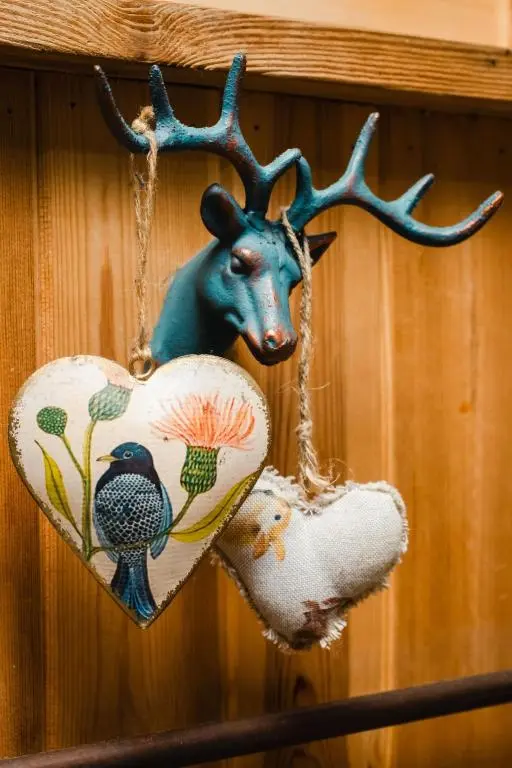 a christmas ornament of a deer with a heart at Holiday Home Shepherds Hut by Interhome in Bearnock