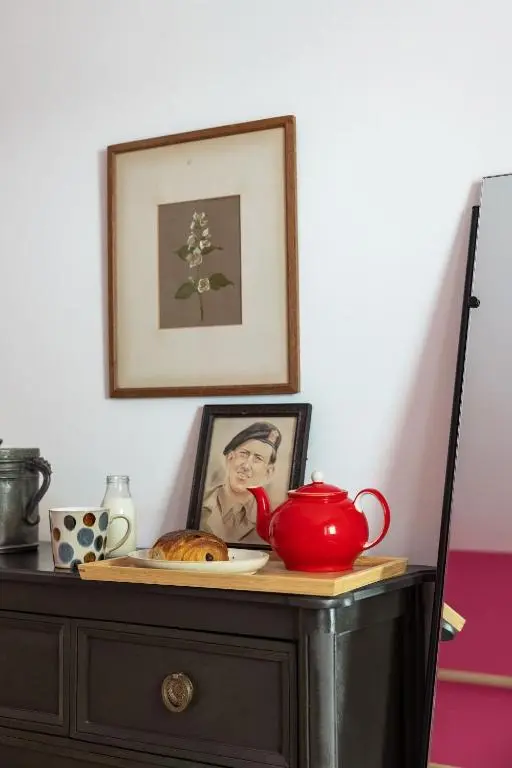 a table with a tea pot and a plate of food at Number 4 Steading Cottage in Banchory