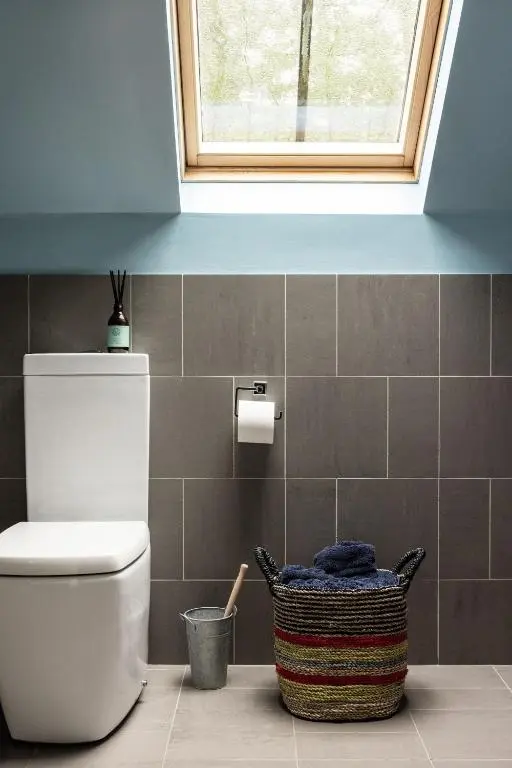 a bathroom with a toilet and a window at Number 4 Steading Cottage in Banchory