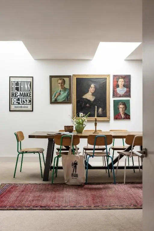 a dining room with a table and some pictures on the wall at Number 4 Steading Cottage in Banchory