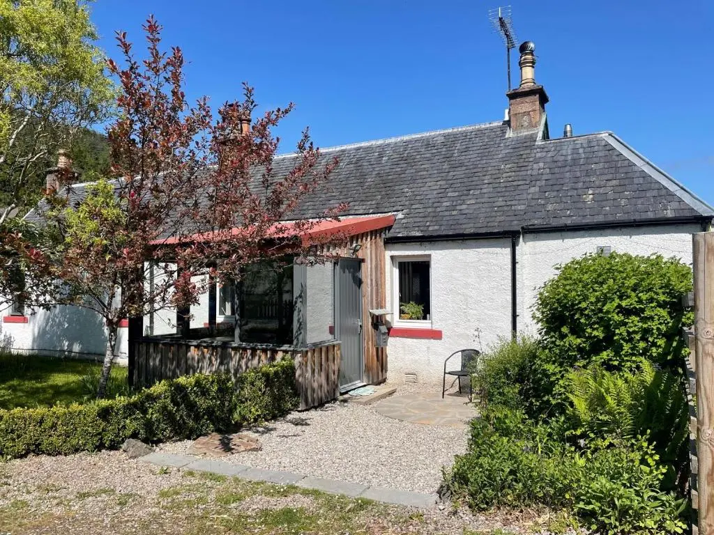 a small white house with a red roof at One bed cosy Highland cottage near Beauly in Beauly