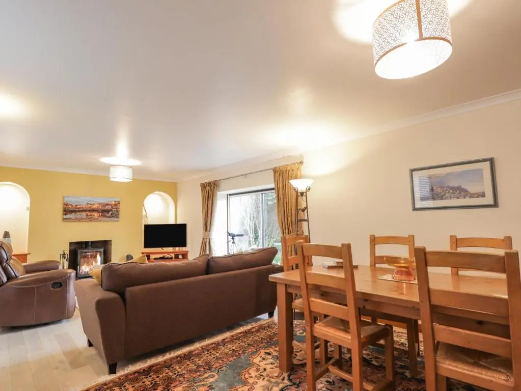 a living room with a couch and a table at 20 South High Street in Portsoy