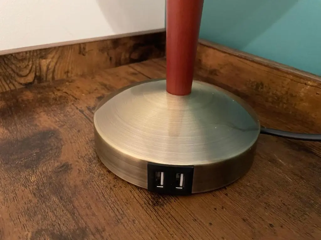 a metal drum on a wooden floor with a red pole at Barclay\u2019s But n Ben in Alford