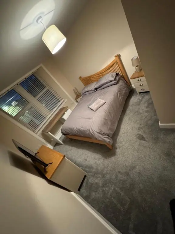 an overhead view of a bedroom with a bed and a window at Central 2 bedroom apartment in Wick