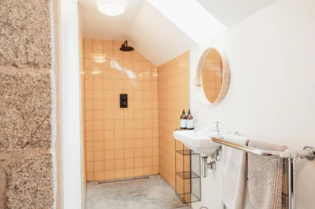 a bathroom with a sink and a shower at The Dell of Abernethy - A Woodland hideaway in Nethy Bridge