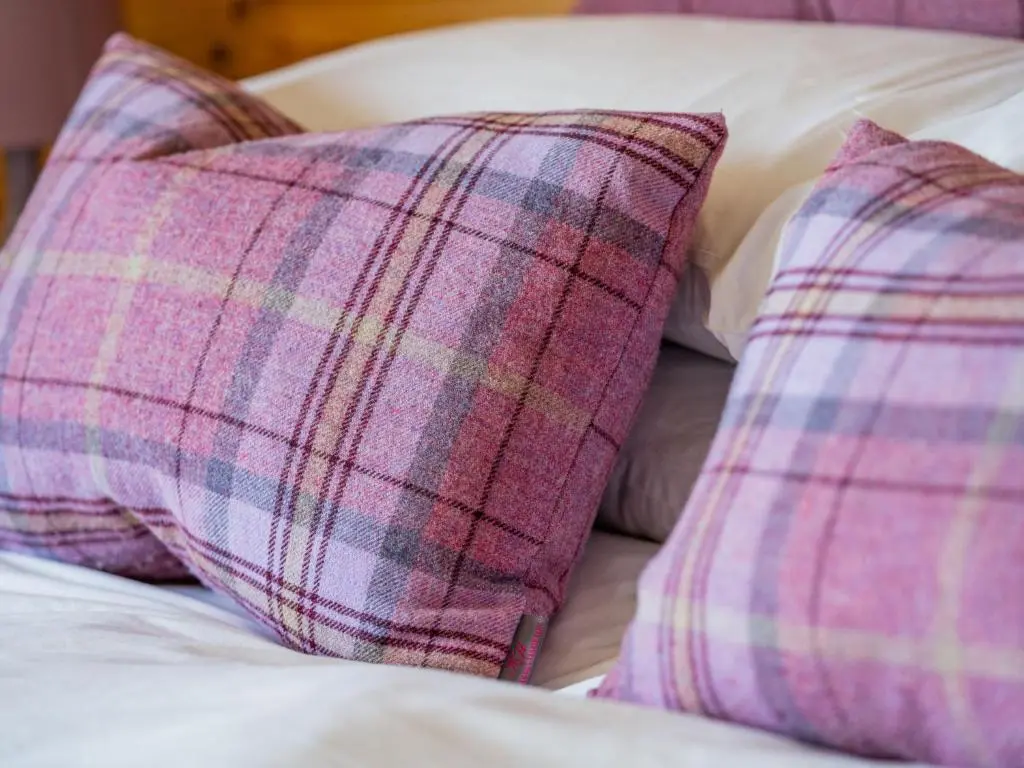 a pair of pillows sitting on top of a bed at Holiday Home Achmony Secluded Westend by Interhome in Drumnadrochit