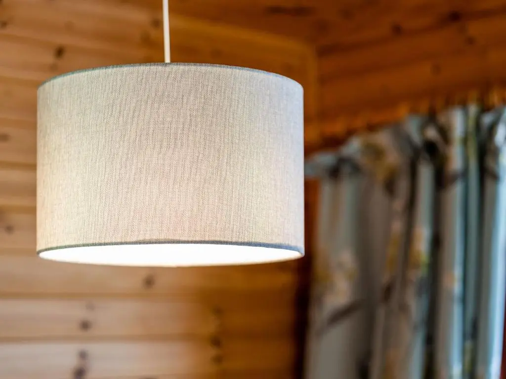a white light fixture hanging from a wall at Holiday Home Achmony Green by Interhome in Drumnadrochit