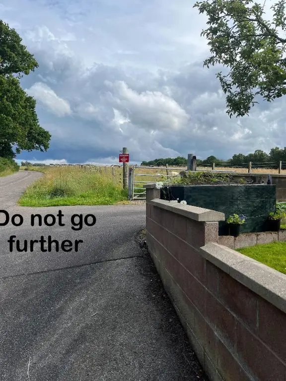 a road with a sign that says do not go further at Bonny Vista in Inverness
